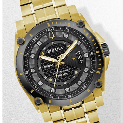 Gold and black Bulova chronograph watch.
