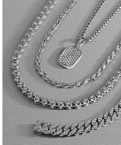 Layered white gold chain necklaces and white gold chain with diamond pendant.