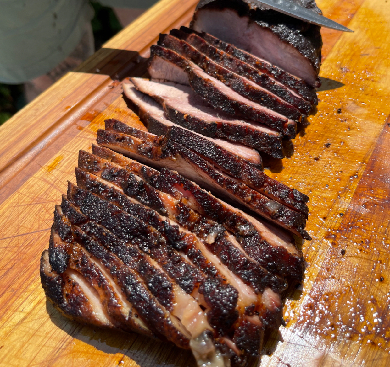 Image of slicing a smoked pork brisket