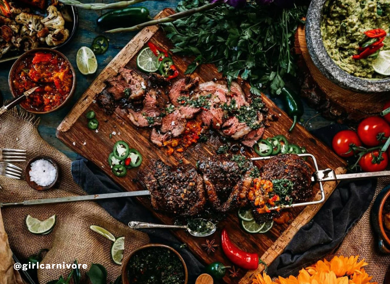Tablescape of grilled and sliced dry aged steak