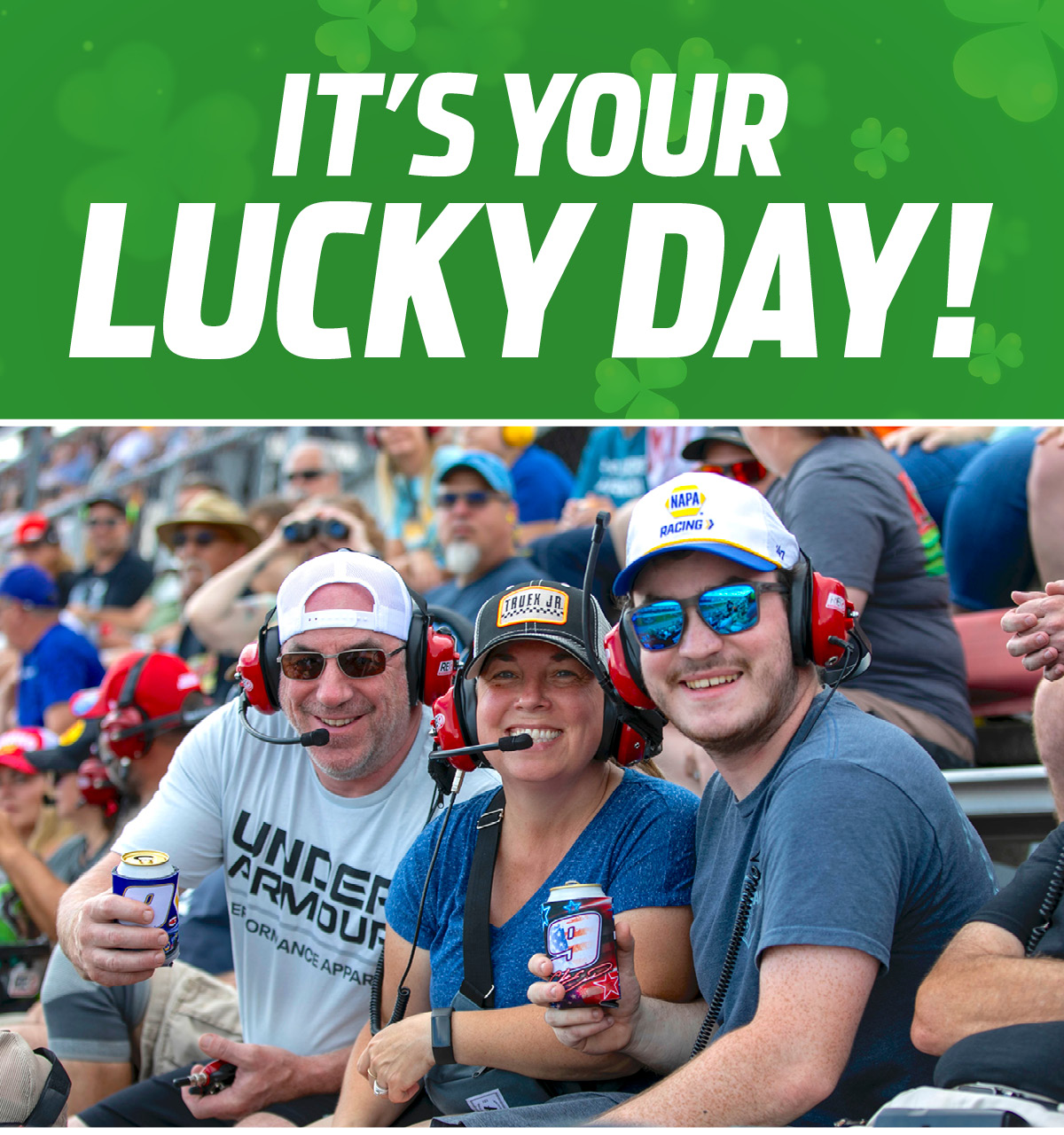 Fans enjoying race day at MIS. Clovers in the background. 