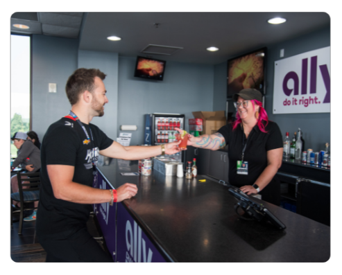 Customer grabbing a drink at the Ally Apex Club 