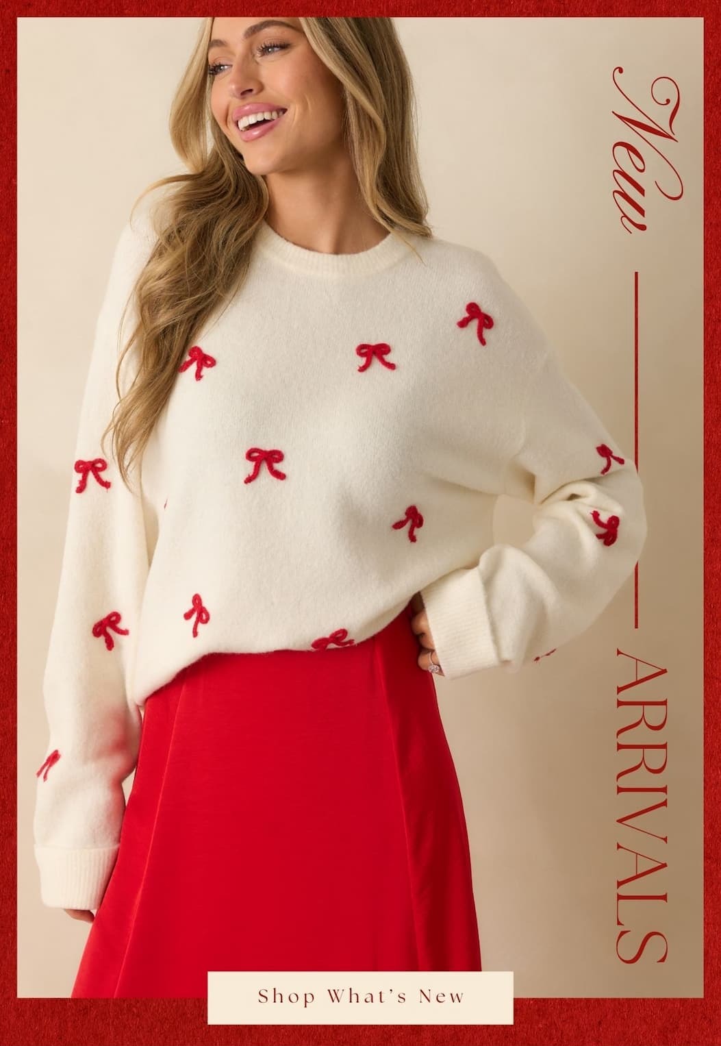 'New Arrivals.' Image of model wearing a white sweater with red bows on it and a red skirt. Button: 'Shop What's New.'