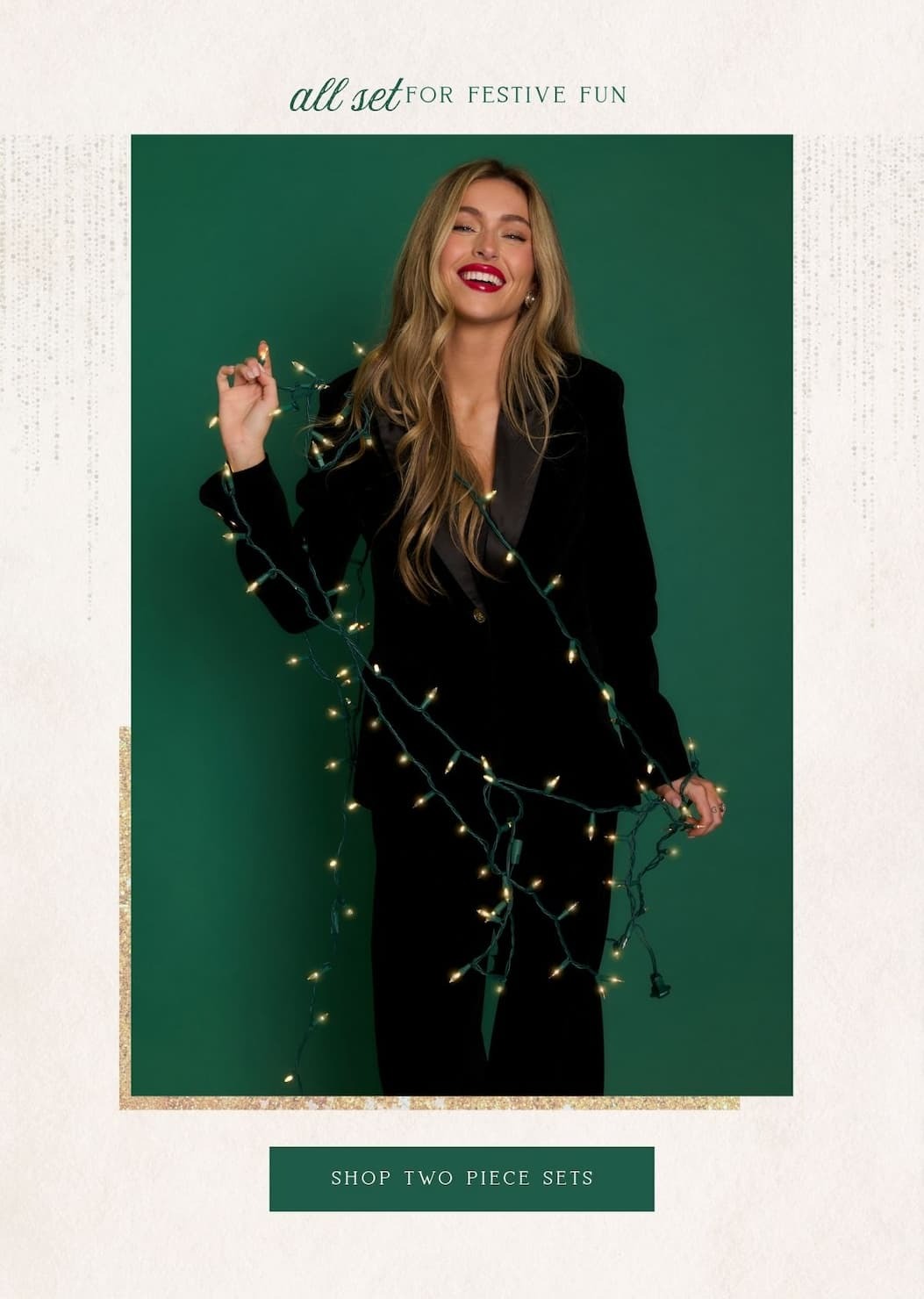 'All set for festive fun.' Image of model wearing a black blazer with matching pants. Button: 'Shop Two Piece Sets.'