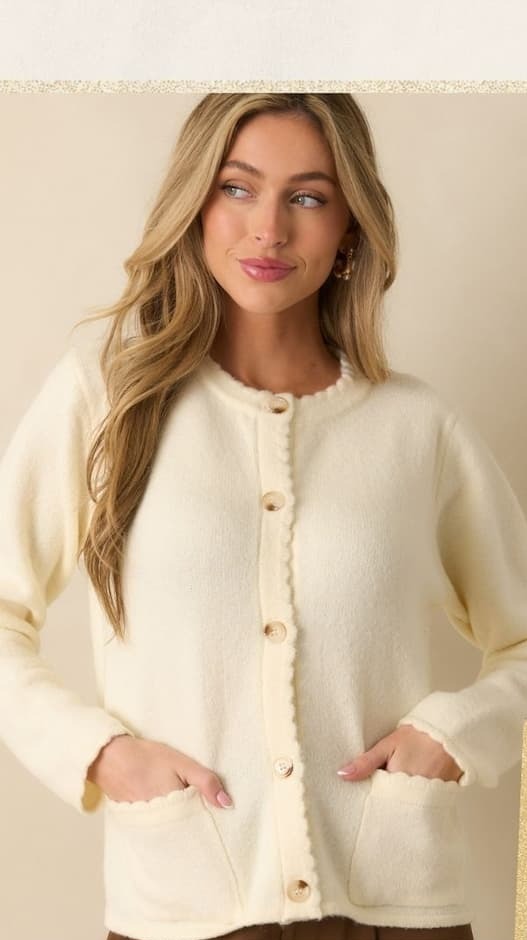 Image of model wearing a Ivory Knit Scallop Hem Button Front Cardigan.