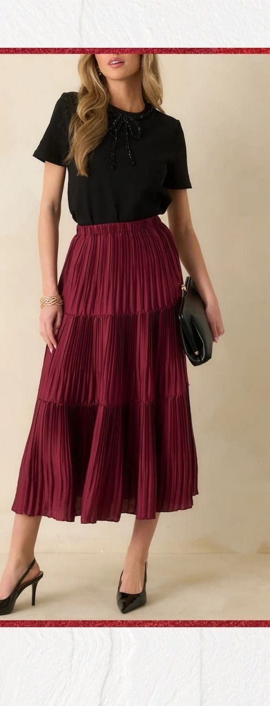 Image of model wearing a Burgundy Tiered Pleated Midi Skirt.