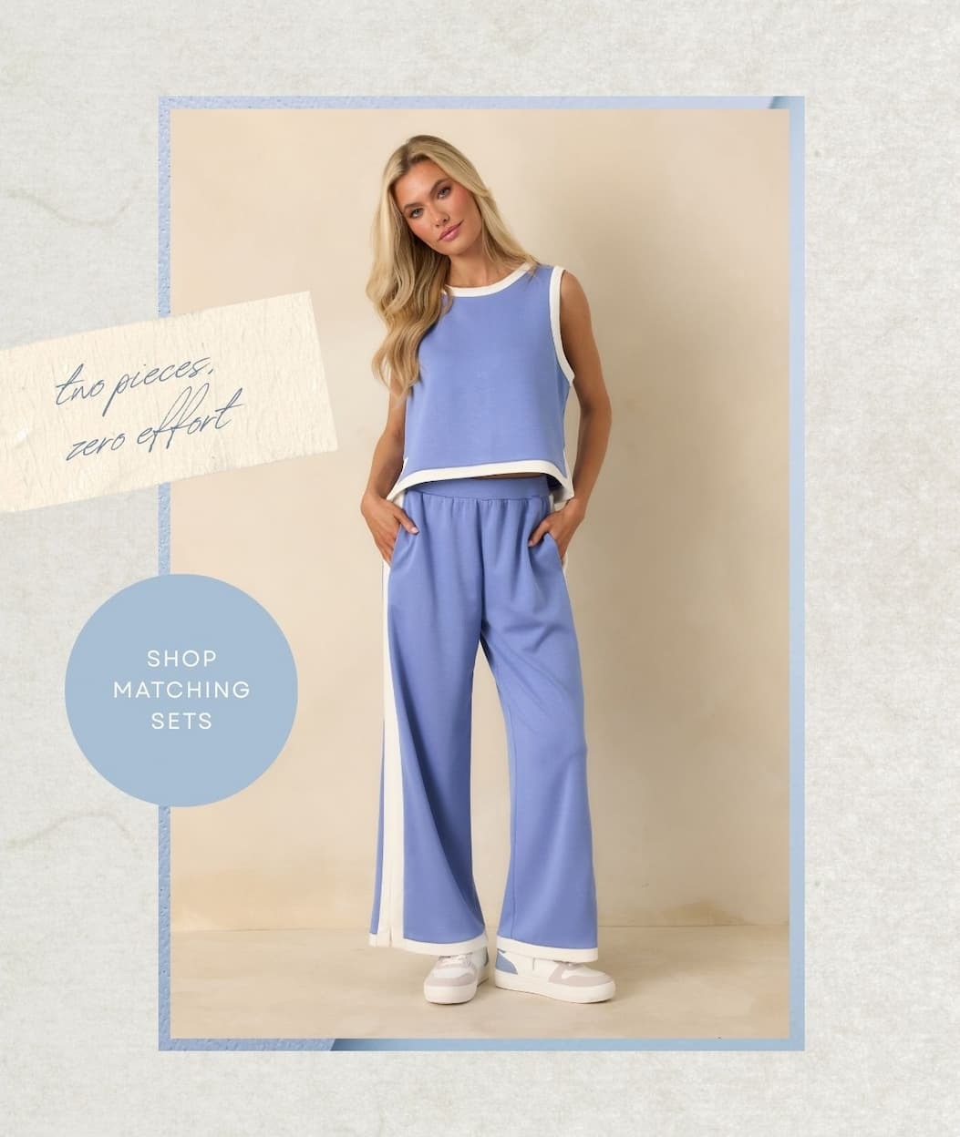 'Two pieces, zero effort.' Button: 'Shop Matching Sets.' Image of model wearing a Periwinkle Stretch Knit Contrast Trim Top with matching pants. 