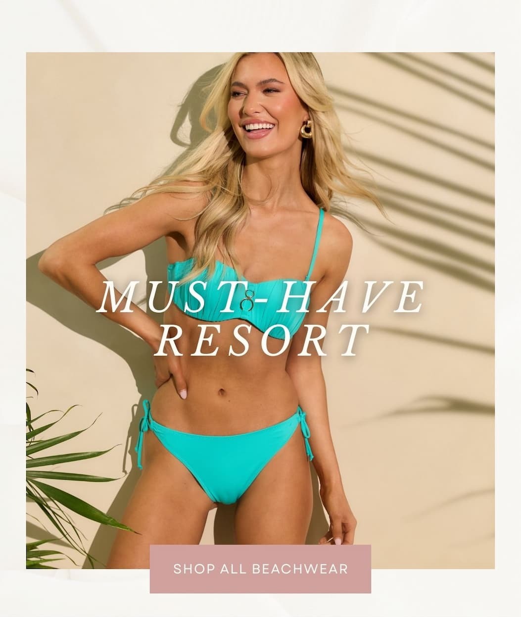 'Must-have resort.' Image of model wearing a Aqua Ruched Balconette Bikini Top with matching bikini bottoms. Button: 'Shop All Beachwear.'