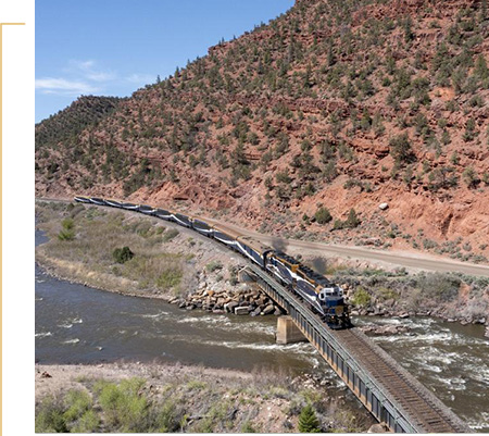 Rocky Mountaineer travelling on Rockies on the Red Rocks route.