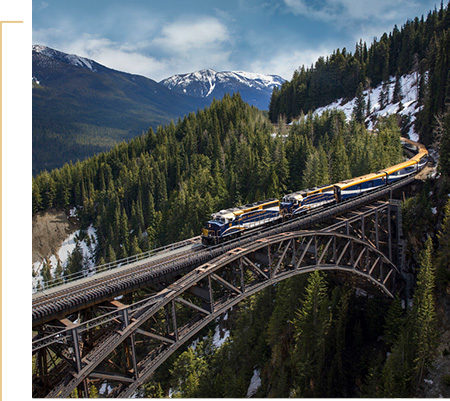 Rocky Mountaineer travelling across Stoney Creek Bridge on the First Passage to the West route.