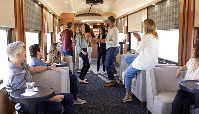 Guests enjoy the SilverLeaf Plus lounge onboard Rocky Mountaineer.