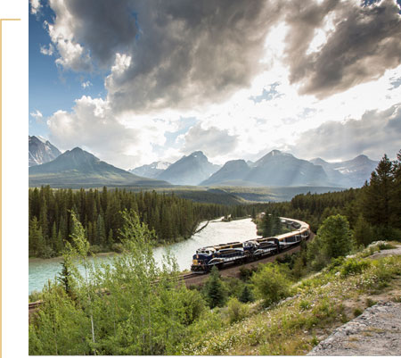 Rocky Mountaineer train travelling alongside a river