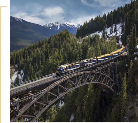 Rocky Mountaineer train travelling across Stoney Creek Bridge.