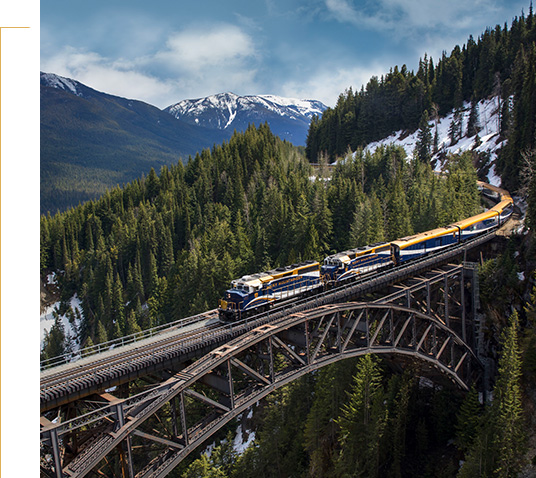 Rocky Mountaineer train travelling across Stoney Creek Bridge.