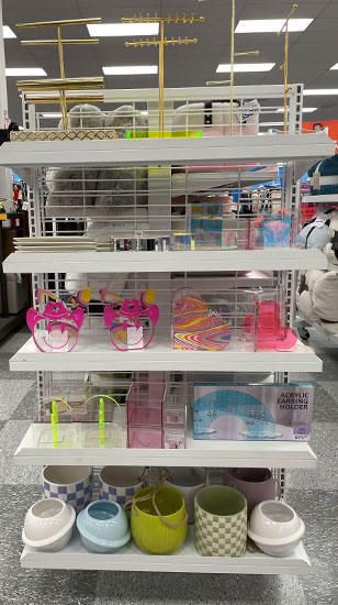 Shelves in a Ross store with dorm room decor.