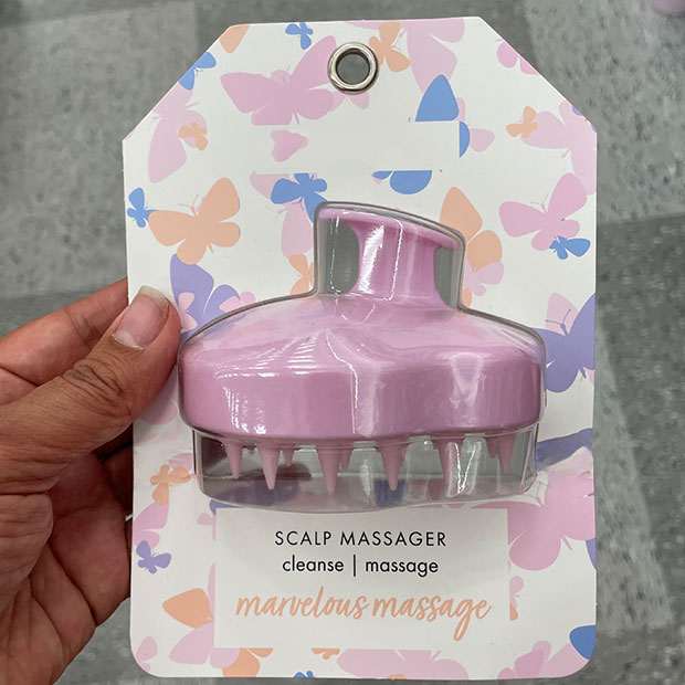 Scalp massager in lavender color.