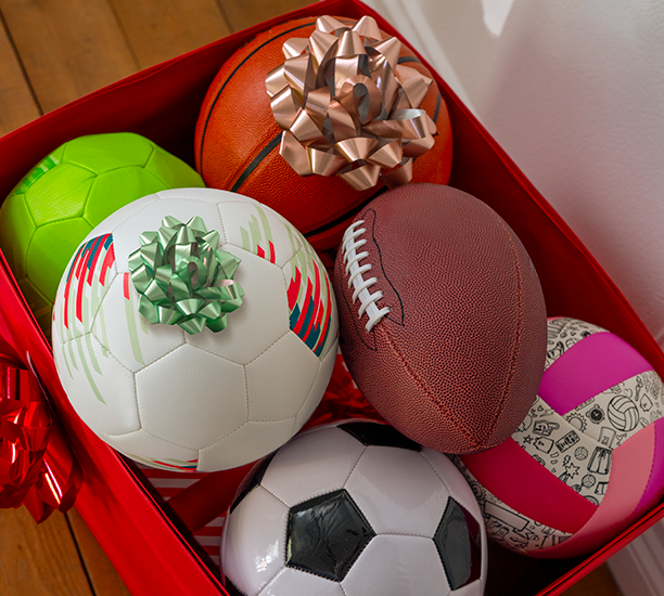 Sports balls with bows ready for gifting from a Ross store.