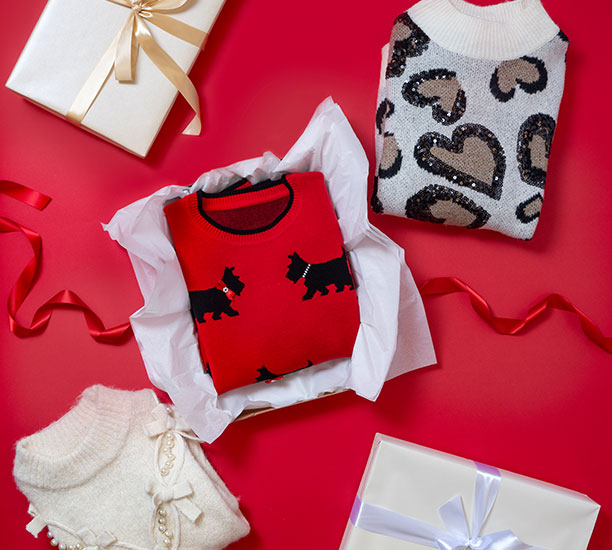 Women's holiday sweaters wrapped up as gifts.