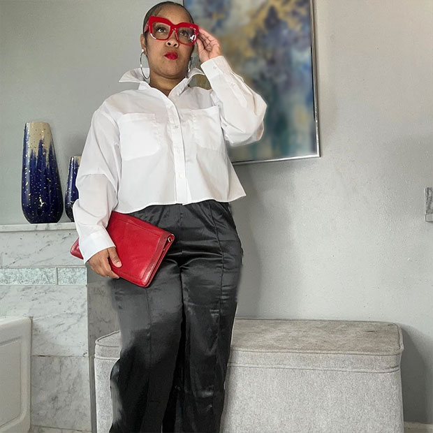 Woman in black satin slacks from Ross.