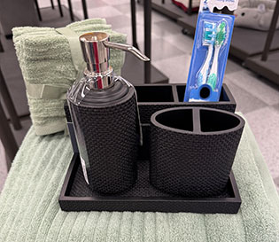Towels and bathroom organizers from a Ross store.