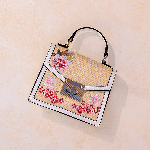 Rattan with floral embellishments box bag with gold hardware from Ross. 