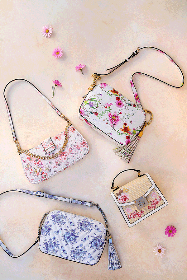 Four floral handbags in rattan, blue, pink and rose colors.  