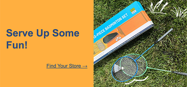 Blue and green rackets and badminton set laid on grass.  