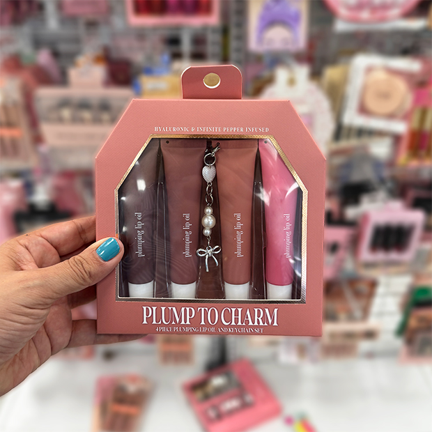 Four lip plumping glosses with bow charm found in store at Ross. 