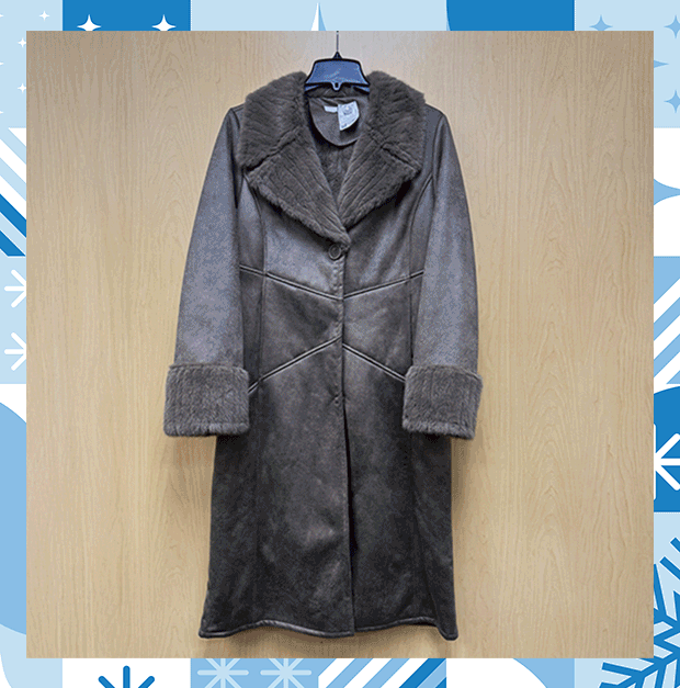 Assortment of coats and jackets hanging against a wooden back from heavyweight to lightweight.  