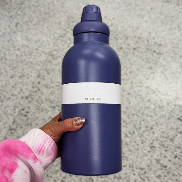 Large navy insulated water bottle with a white label band, found in store at Ross.  