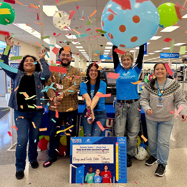 Ross store associates celebrating raising donations for the Boys & Girls Club.