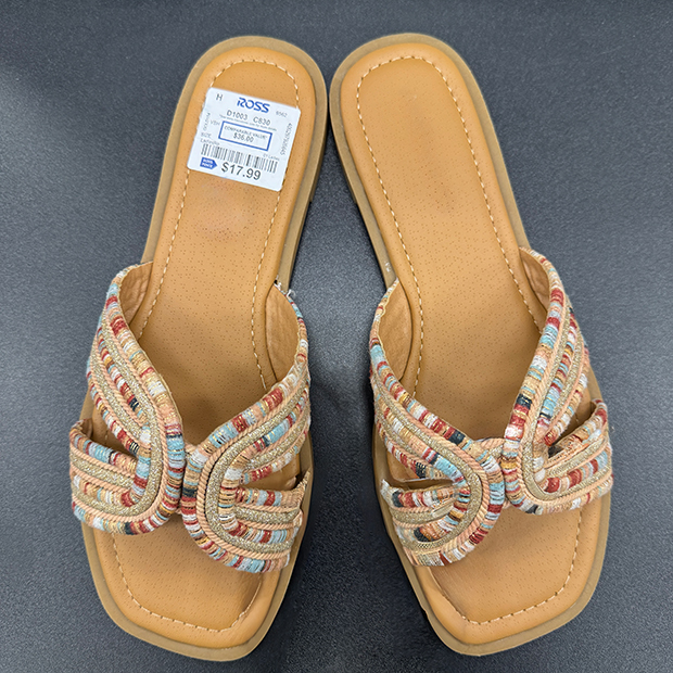 Tan slide sandals with a multicolor woven knotted strap and lightly padded square-toe footbeds. 