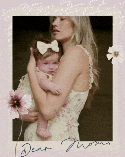 Mother and baby dancing in summer dresses. 