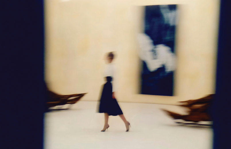 photograph of a woman walking