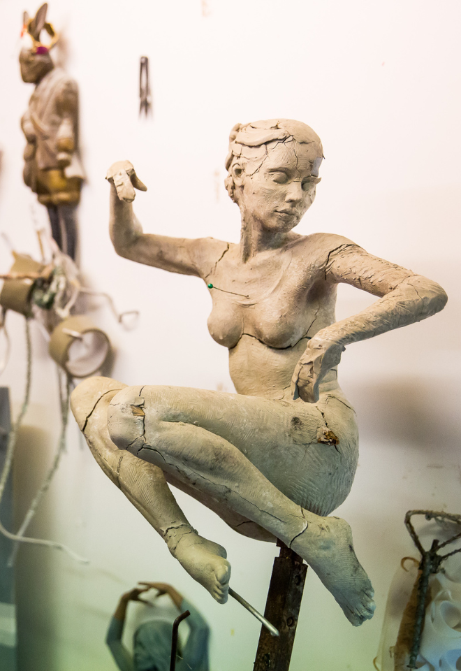 mid-process clay sculpture of a woman