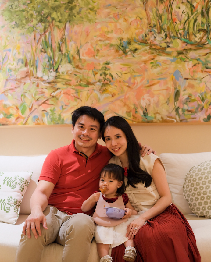 photo of family in front of artwork