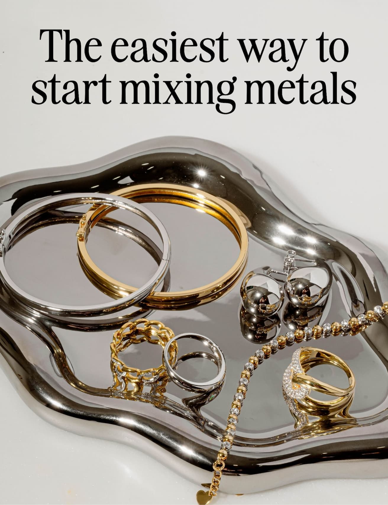 mixed metal jewelry on silver tray