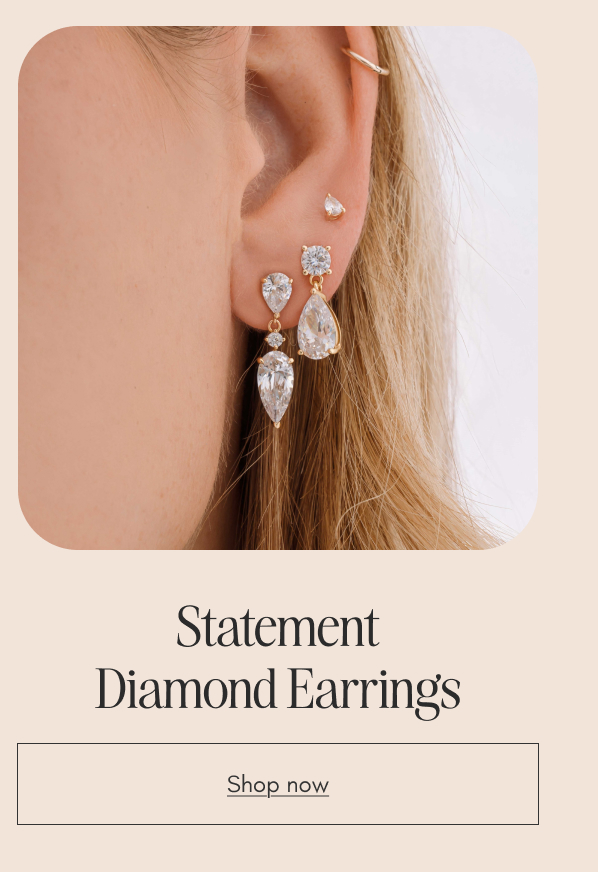 Statement cubic zirconia drop earrings on a model. Shop statement diamond earrings.
