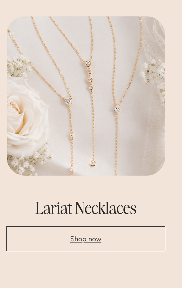 Layered gold lariat necklaces with cubic zirconia drops. Shop lariat necklaces. 