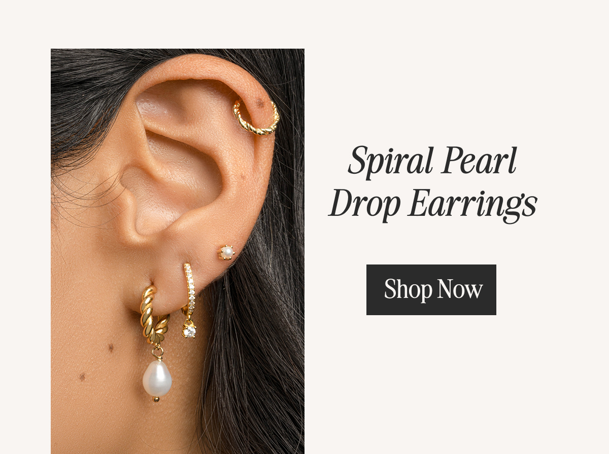 Spiral Pearl Drop Earrings styled with gold ear cuff and stud, shop now