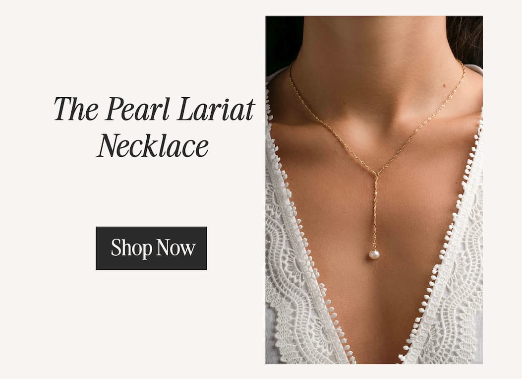 The Pearl Lariat Necklace — delicate gold twisted chain with a freshwater pearl drop. Shop Now.