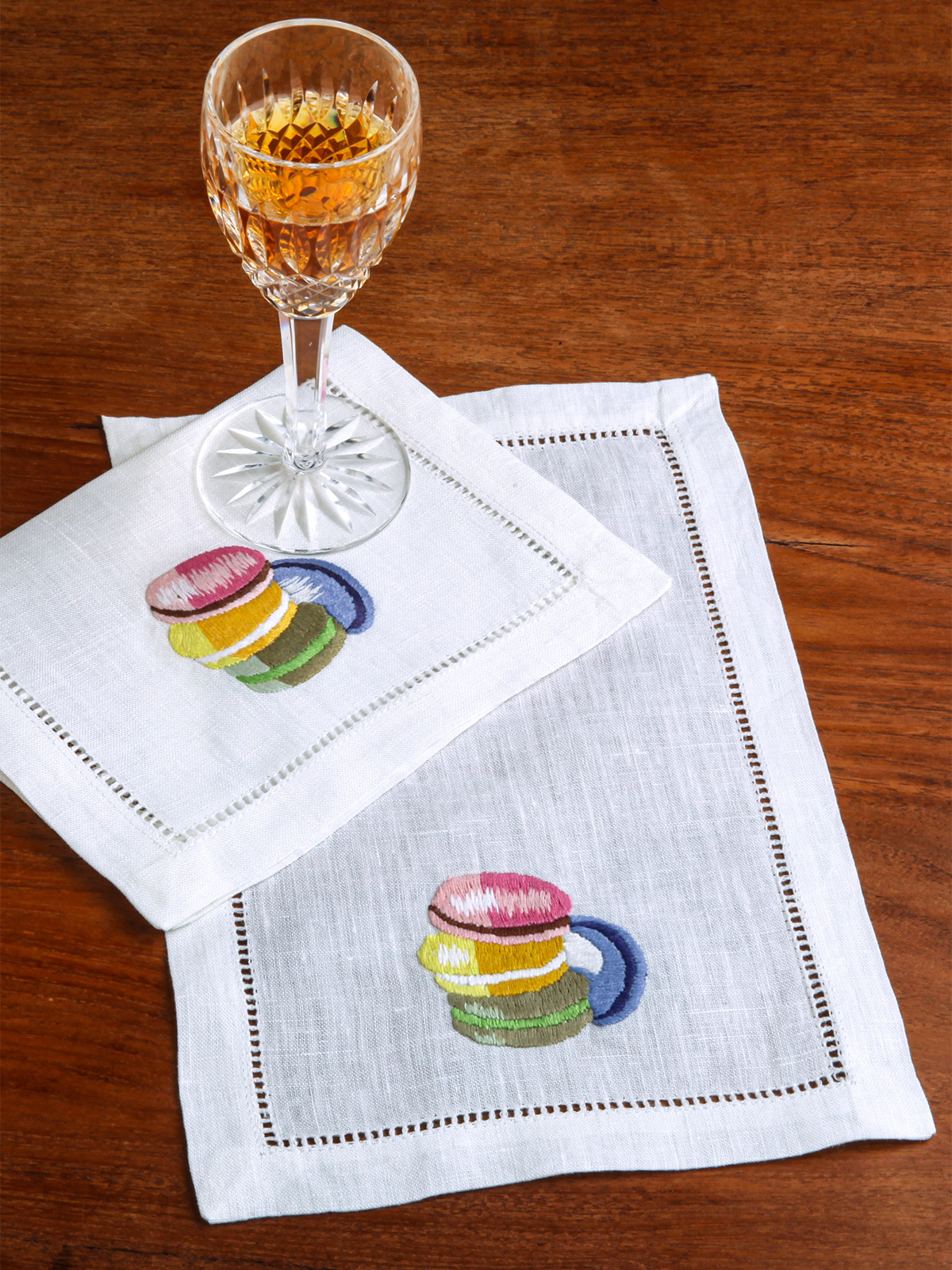 Colorful macarons make the sweetest set of cocktail napkins.