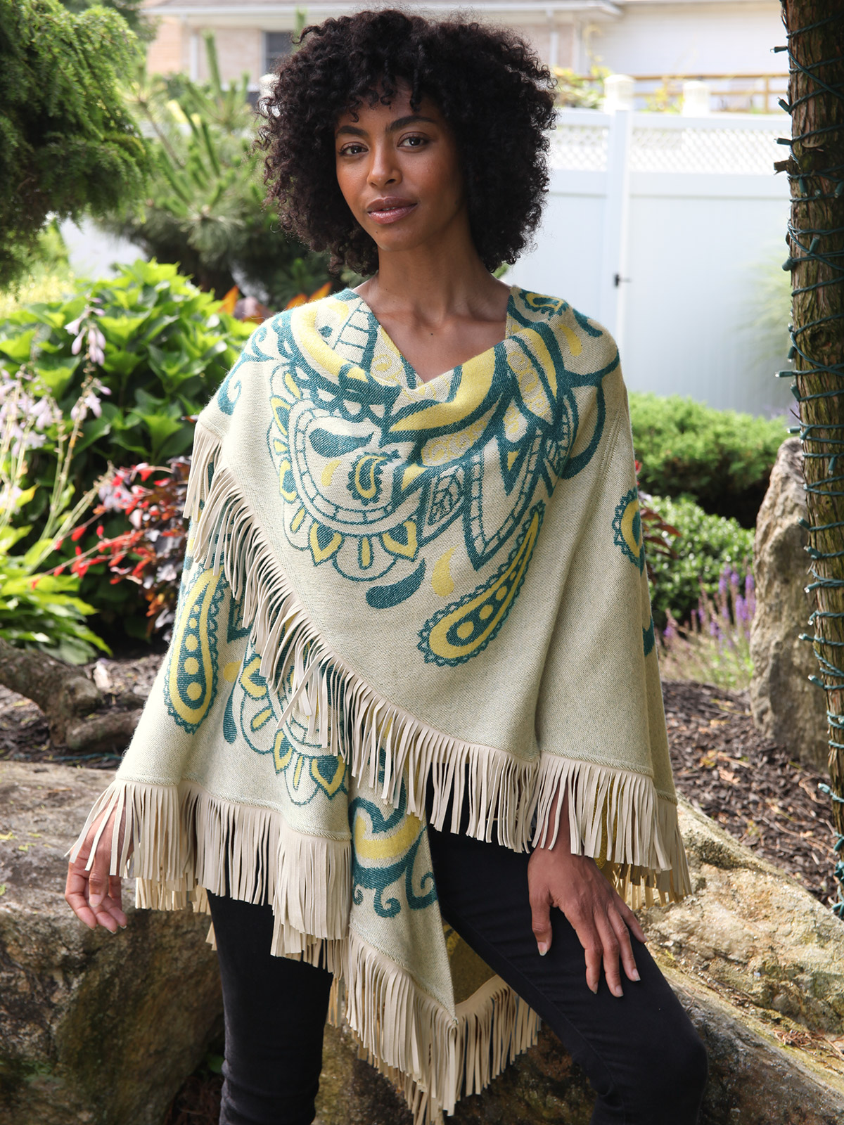 A luxe wrap with natural suede fringe is versatility at its most glamorous.