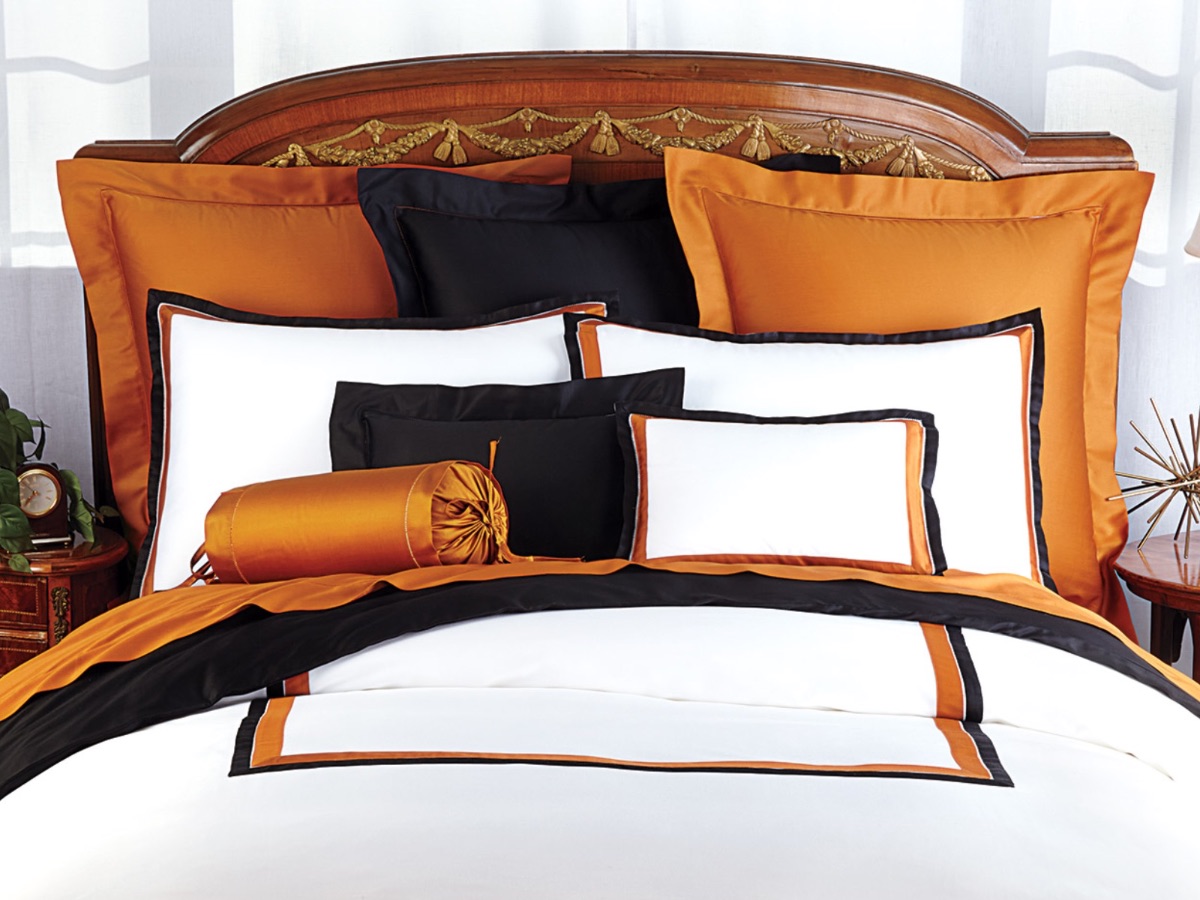 Uniquely original bedding from Italy. Features a glamorous display of Cinnamon, Black and White.