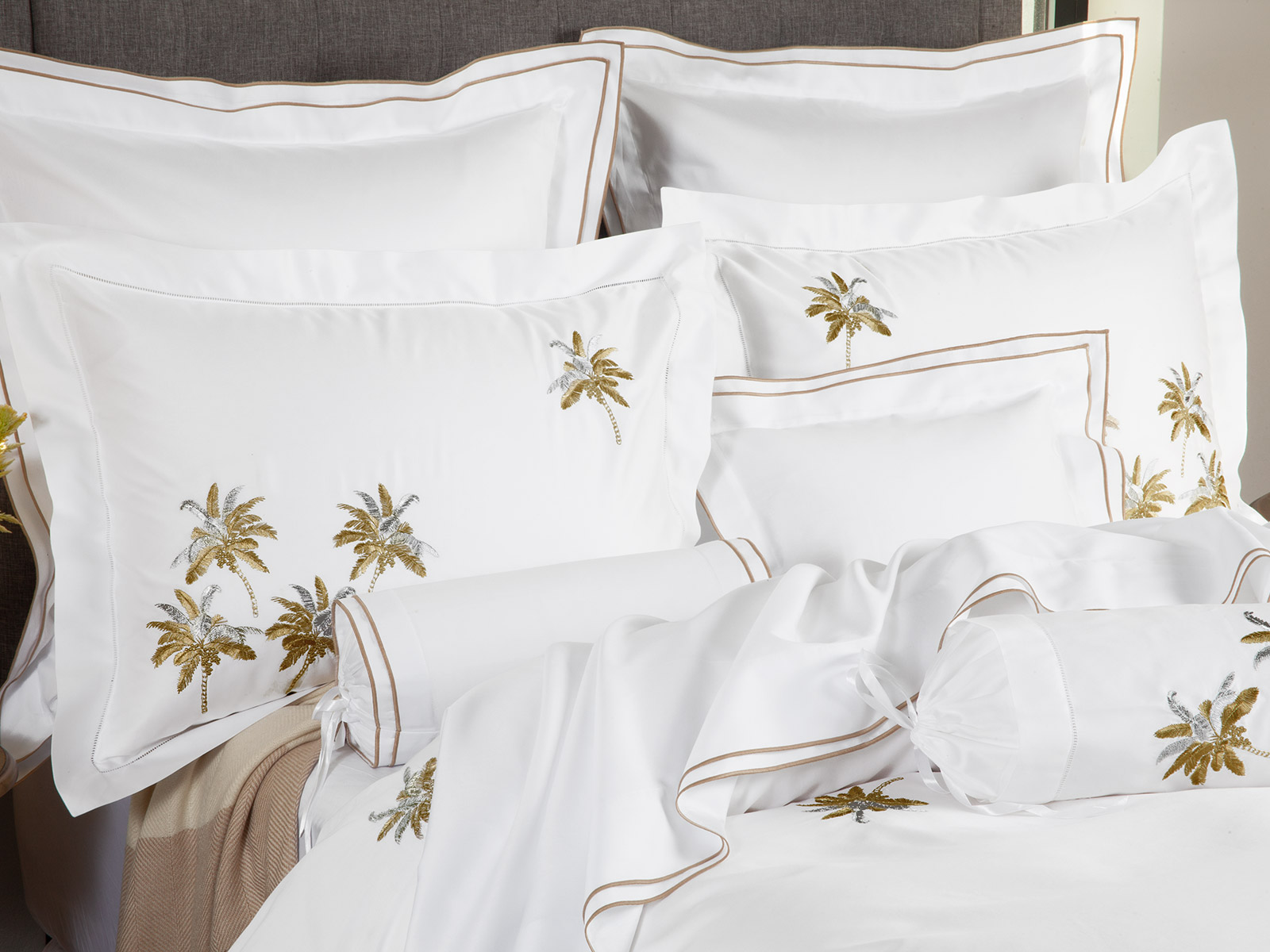 Stunning hand-embroidered leaves in shimmering Silver and Gold on the timeless luxury of 600 thread count sateen.