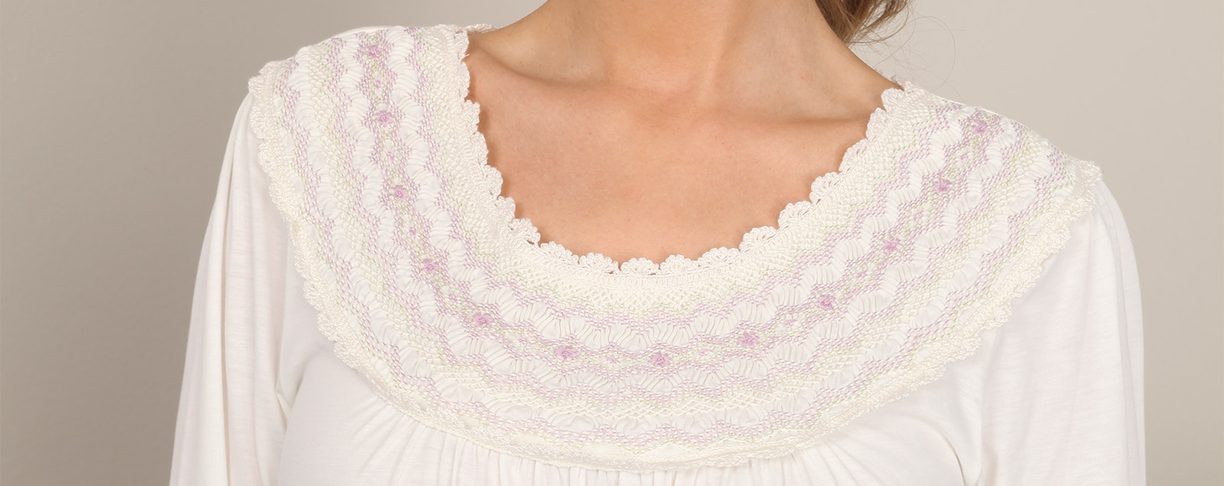 Hand-smocked for you in Peru, with striking detailing along the neckline