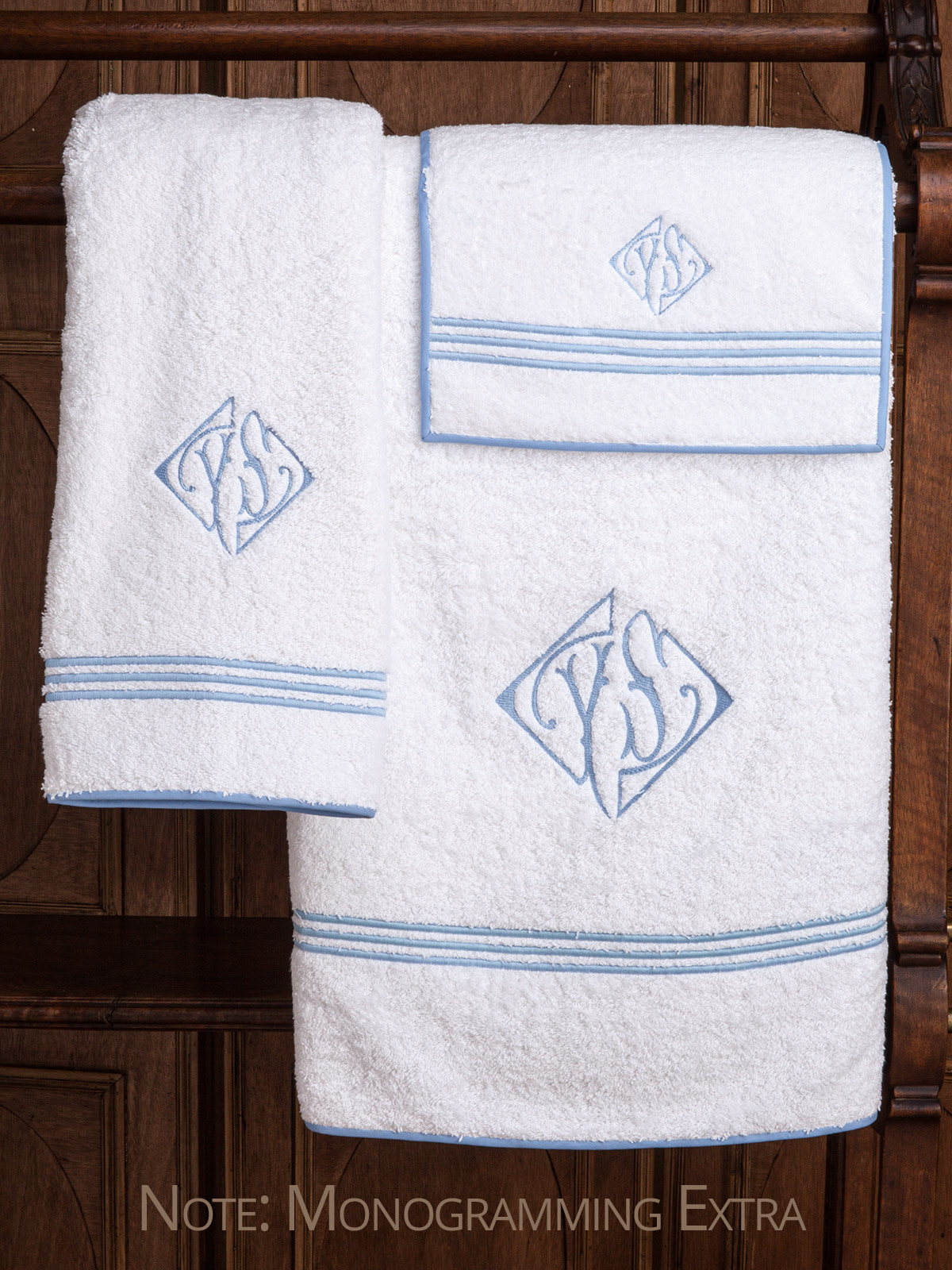 Classic, pure linen guest towels are the height of luxury with crisp, three line embroidery underlined with a narrow zig-zag finish and flanged for simple elegance