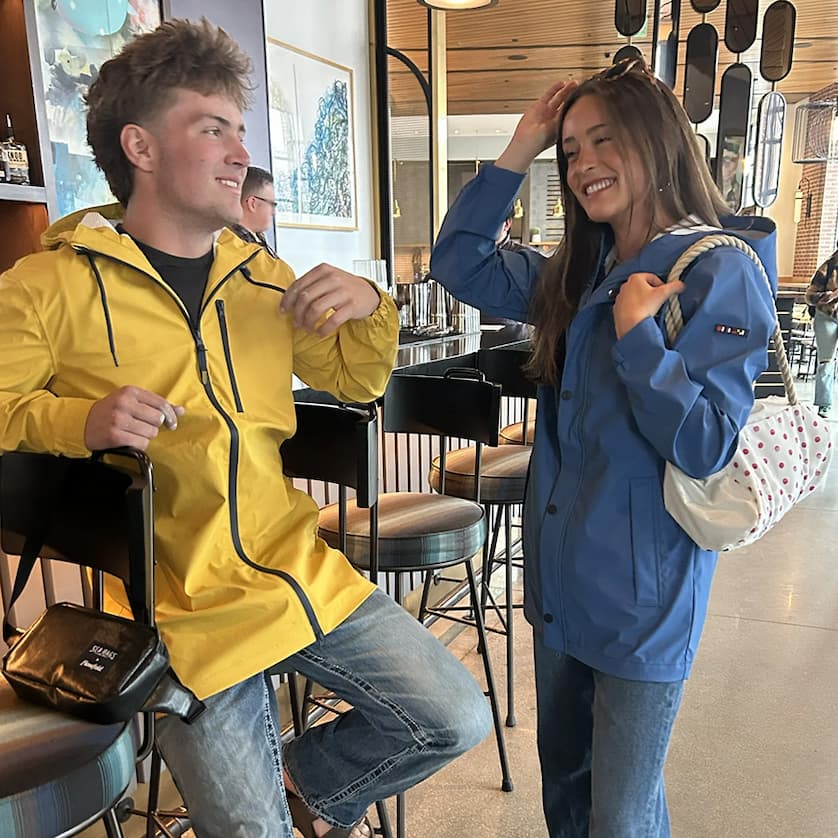 Friends in raincoats