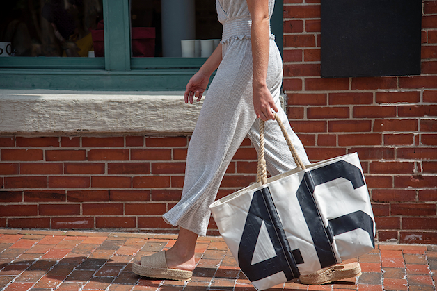 Woman walking with a vintage large tote from Sea Bags