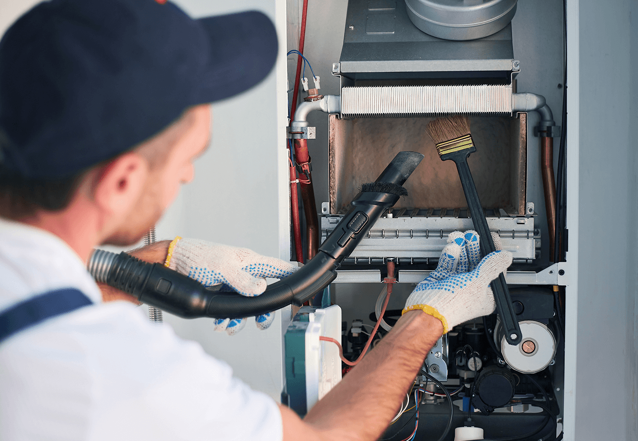 A Sears technician checking out a furnace